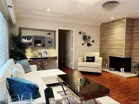 a living room with furniture fireplace and flat screen tv