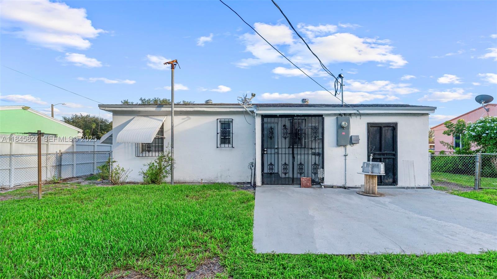 1235 Northwest 86th Street Miami, FL 33147 - Photo 11 of 37 a view of a house with porch and garden