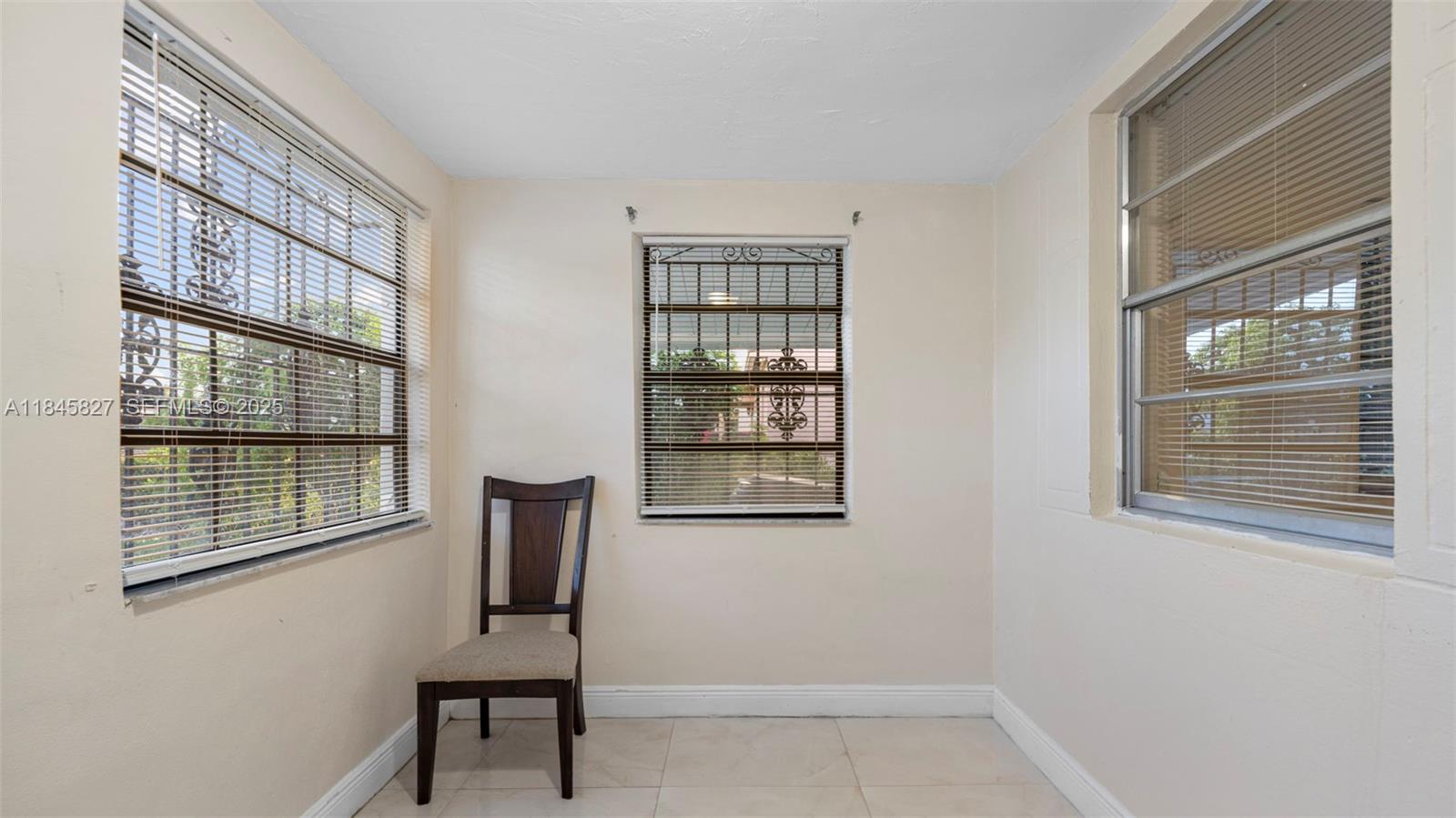 1235 Northwest 86th Street Miami, FL 33147 - Photo 12 of 37 a view of a livingroom with furniture and windows
