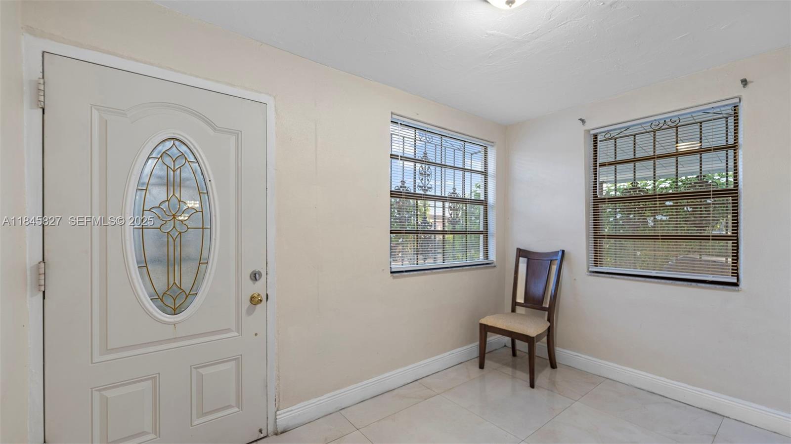 1235 Northwest 86th Street Miami, FL 33147 - Photo 13 of 37 a view of a livingroom with furniture and windows