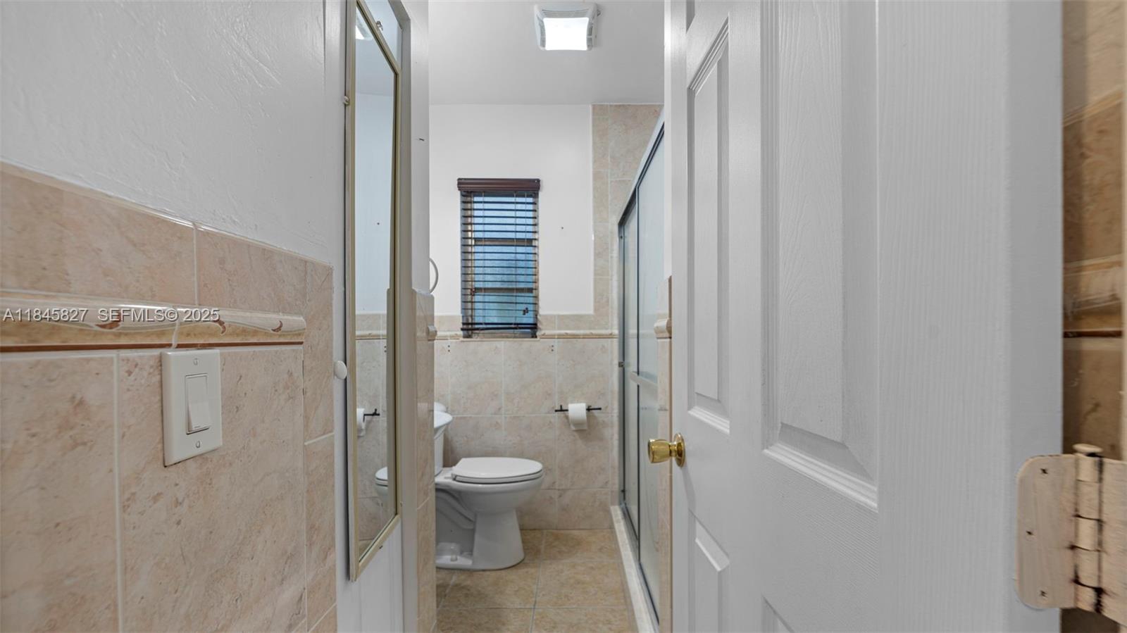 1235 Northwest 86th Street Miami, FL 33147 - Photo 26 of 37 a bathroom with a toilet and shower