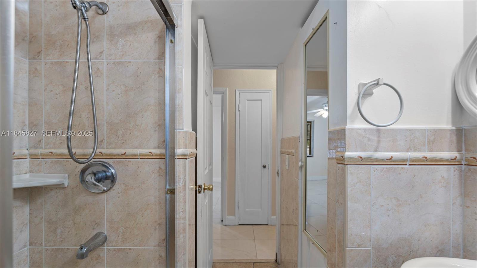 1235 Northwest 86th Street Miami, FL 33147 - Photo 28 of 37 a bathroom with a shower