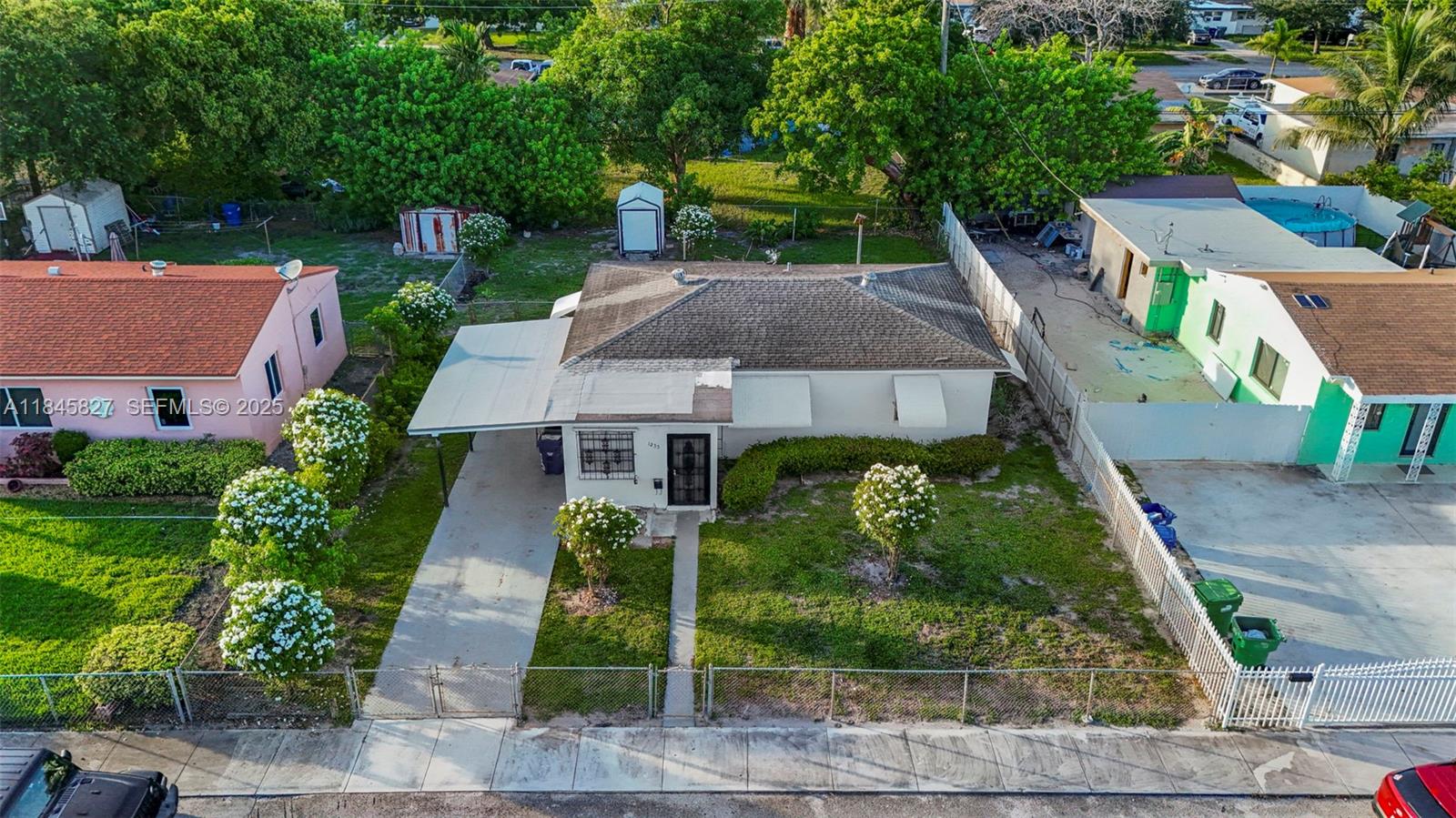 1235 Northwest 86th Street Miami, FL 33147 - Photo 30 of 37 a aerial view of a house with a yard and potted plants