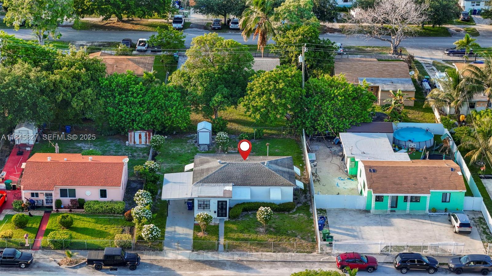 1235 Northwest 86th Street Miami, FL 33147 - Photo 34 of 37 an aerial view of multiple houses with yard