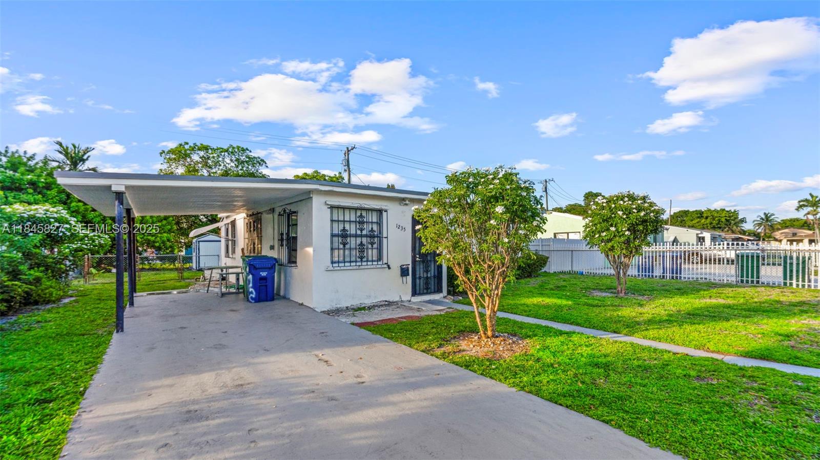 1235 Northwest 86th Street Miami, FL 33147 - Photo 6 of 37 a view of a house with garden and plants