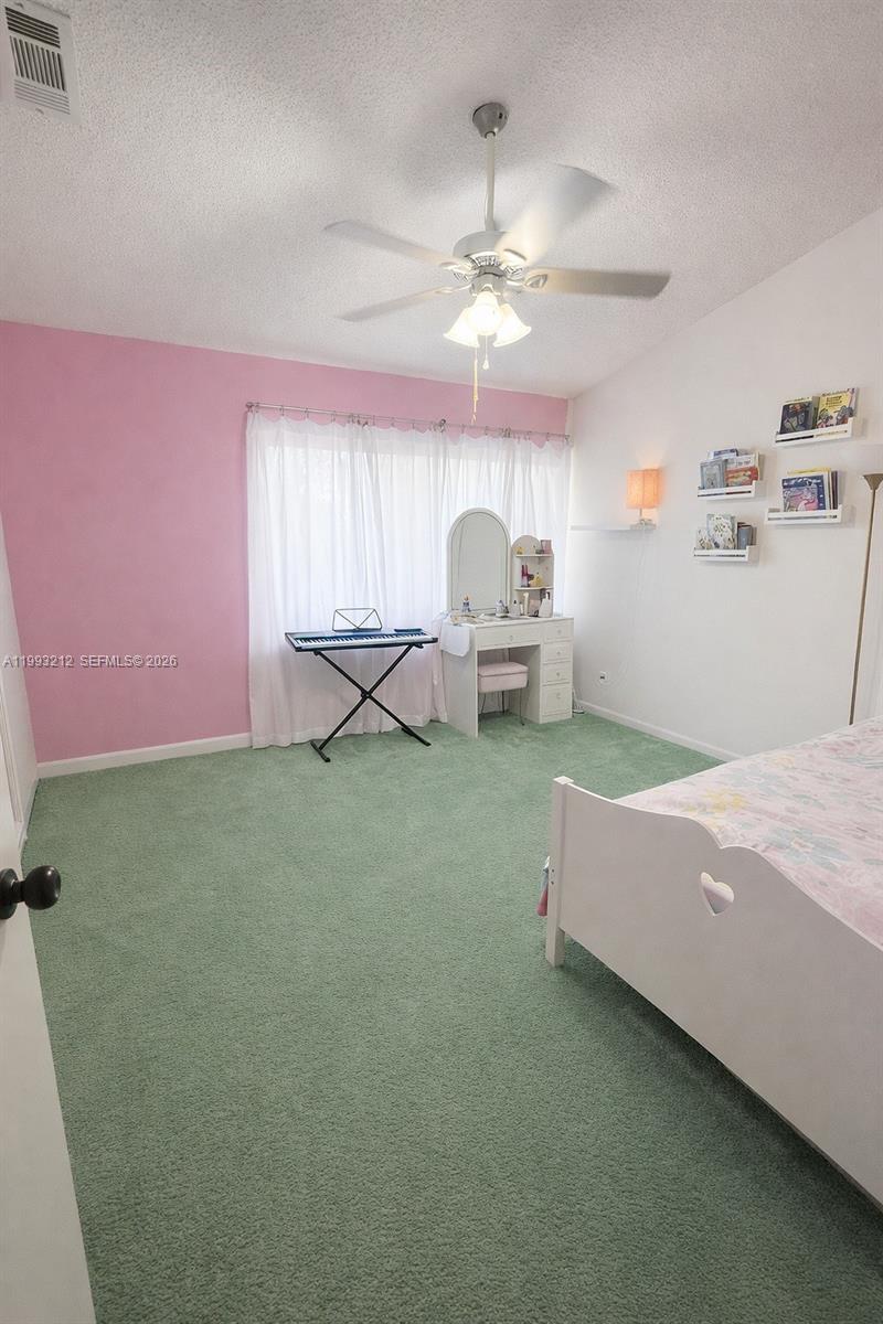 4321 Southwest 70th Terrace Davie, FL 33314 - Photo 11 of 15 a living room with furniture and a chandelier