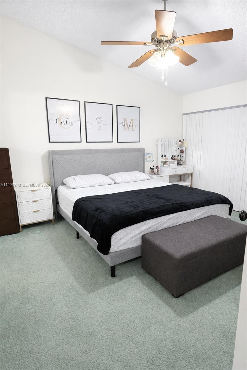 4321 Southwest 70th Terrace Davie, FL 33314 - Photo 12 of 15 a bedroom with a bed and a chandelier