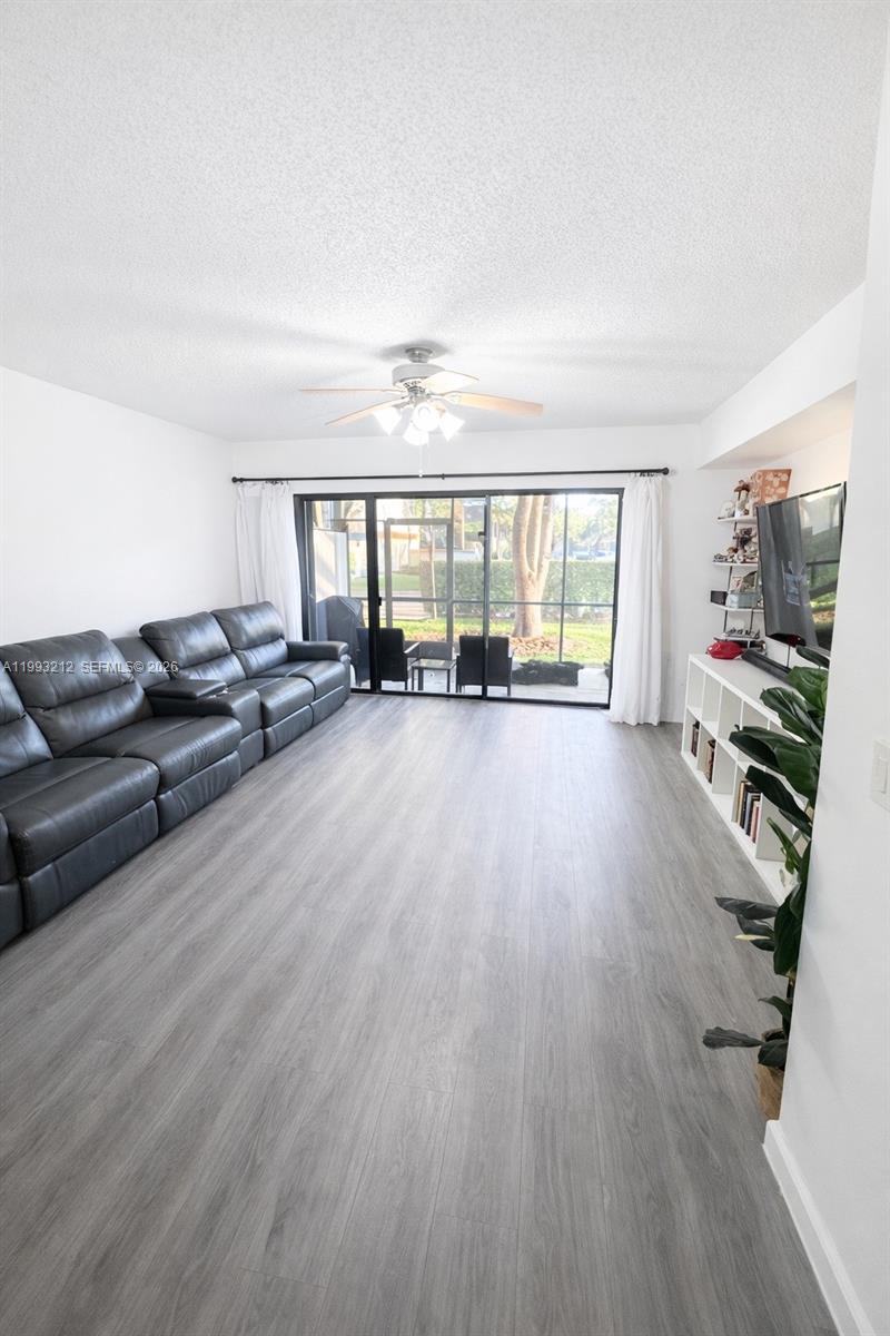 4321 Southwest 70th Terrace Davie, FL 33314 - Photo 5 of 15 a living room with furniture and a flat screen tv