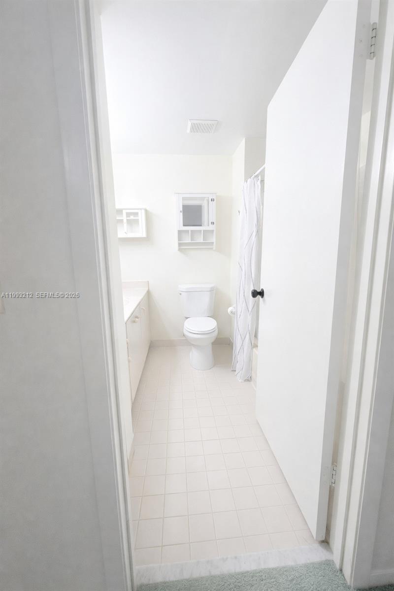 4321 Southwest 70th Terrace Davie, FL 33314 - Photo 10 of 15 a bathroom with a toilet and a shower