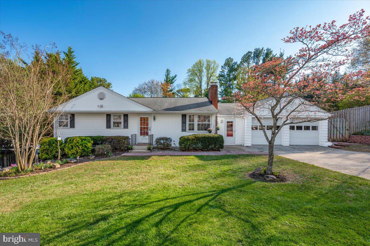 10508 Sweepstakes Road Damascus, MD 20872 - Photo 1 of 46 a front view of a house with yard and green space