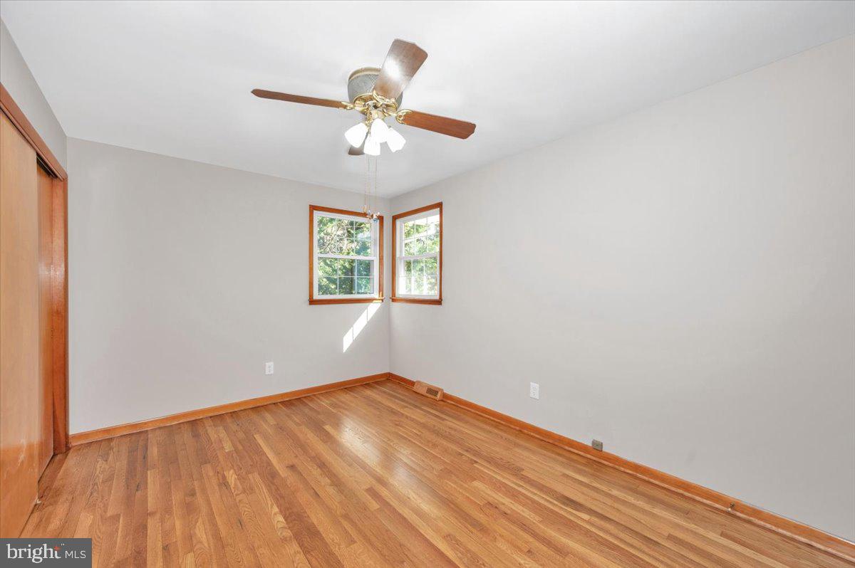 10508 Sweepstakes Road Damascus, MD 20872 - Photo 15 of 46 wooden floor in an empty room with a window