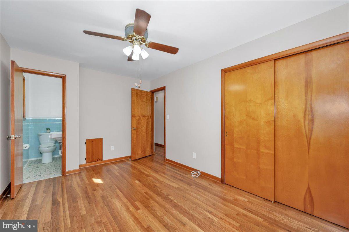 10508 Sweepstakes Road Damascus, MD 20872 - Photo 16 of 46 a view of empty room with wooden floor and fan