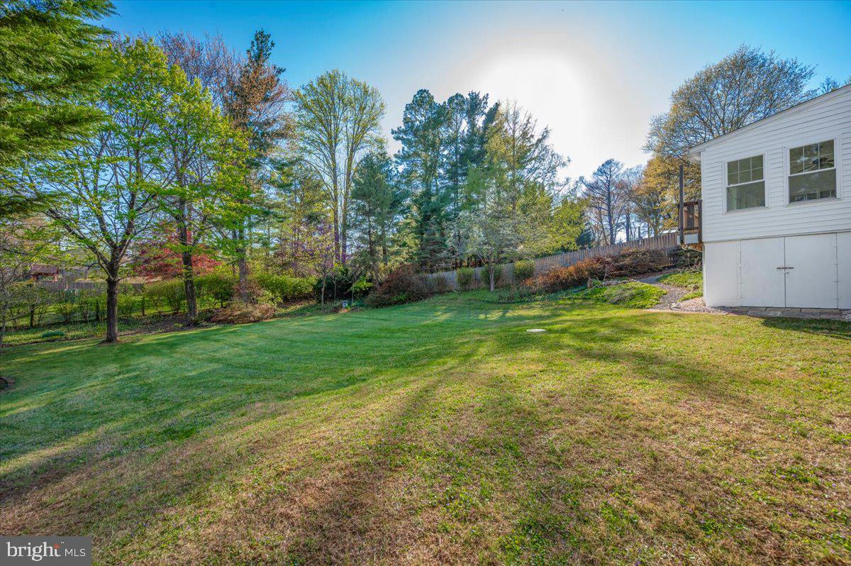 10508 Sweepstakes Road Damascus, MD 20872 - Photo 40 of 46 a view of a backyard with a garden