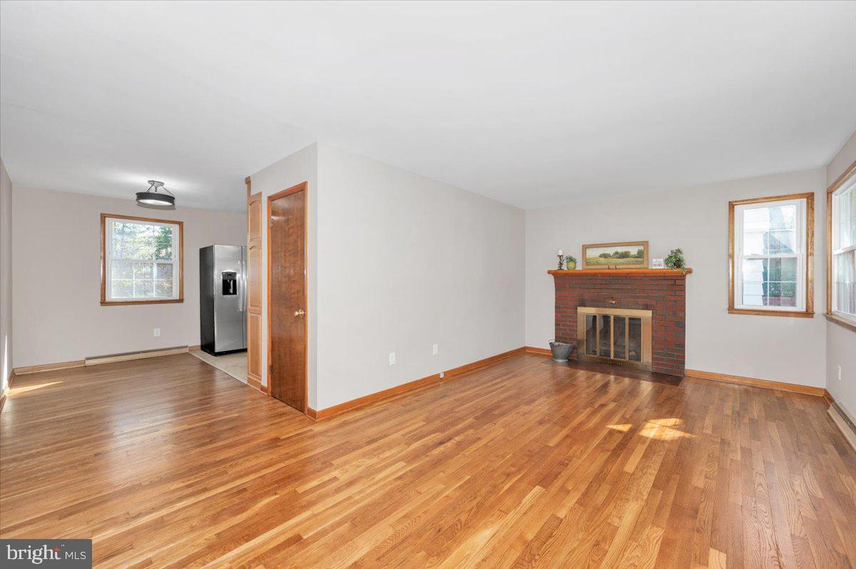 10508 Sweepstakes Road Damascus, MD 20872 - Photo 5 of 46 wooden floor in an empty room with a window