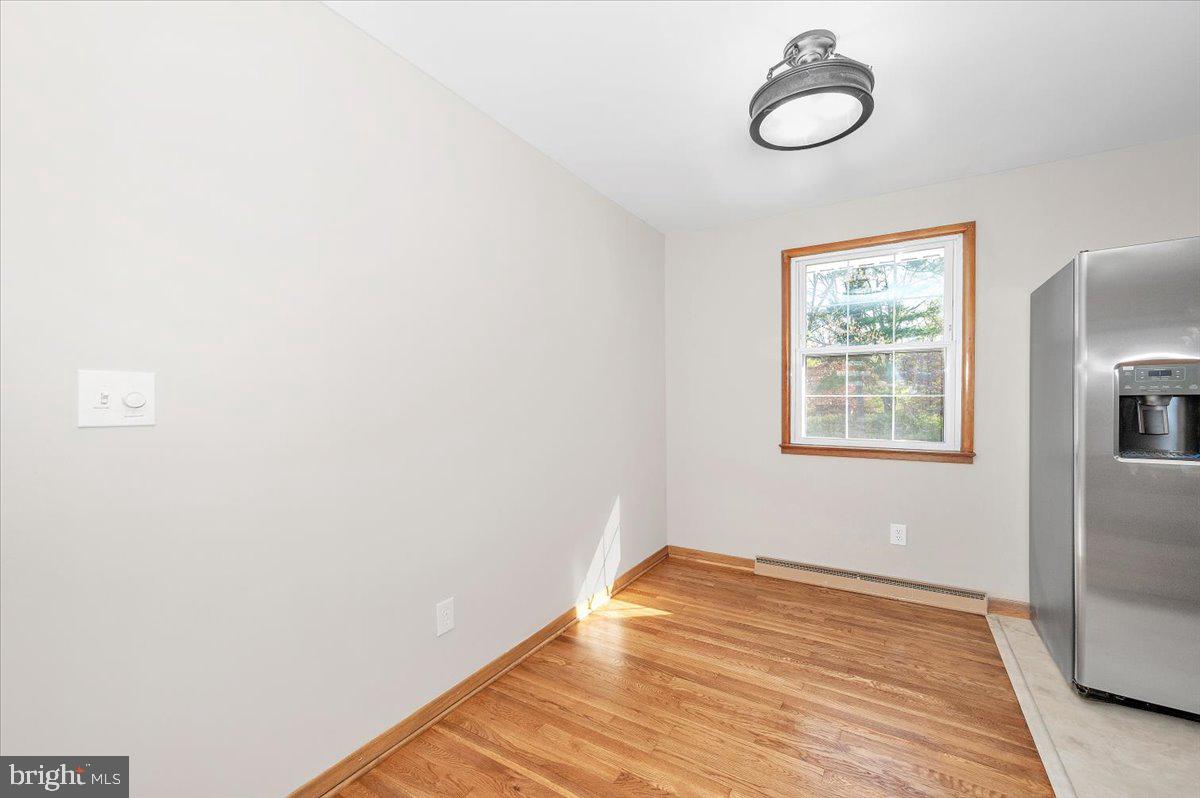 10508 Sweepstakes Road Damascus, MD 20872 - Photo 7 of 46 a view of a room with wooden floor and windows