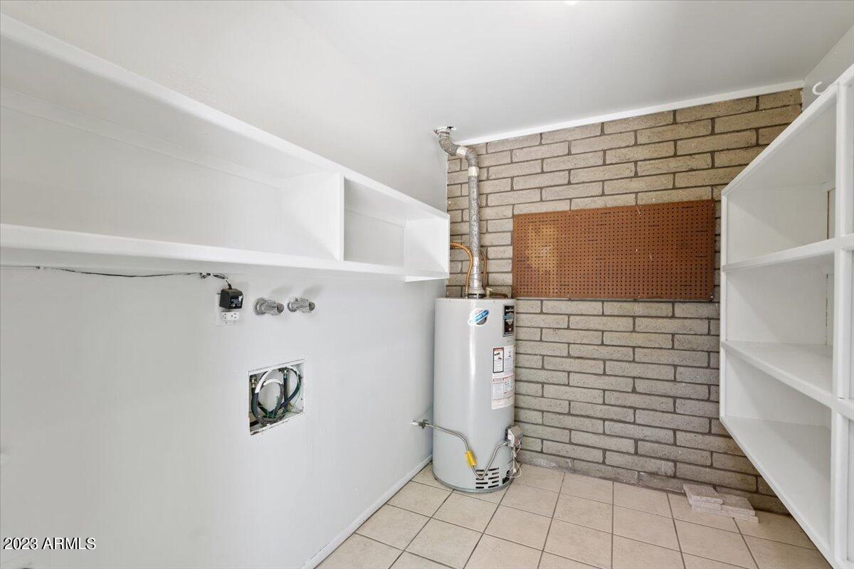 3736 East Montecito Avenue Phoenix, AZ 85018 - Photo 16 of 18 Laundry room with storage