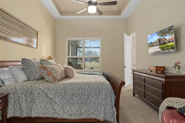 a view of living room with patio furniture and a floor to ceiling window