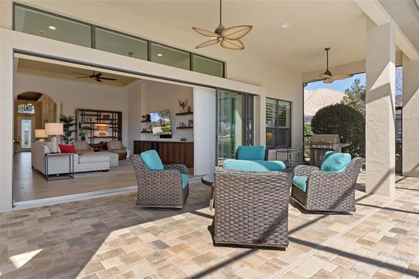 a view of a patio with table and chairs