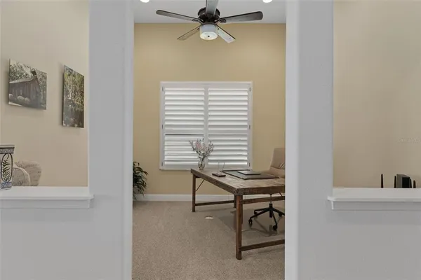 a kitchen with stainless steel appliances wooden cabinets a stove a sink and a microwave