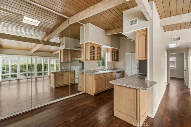 a kitchen with stainless steel appliances granite countertop a sink and cabinets