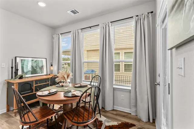 a view of a dining room with furniture window and outside view