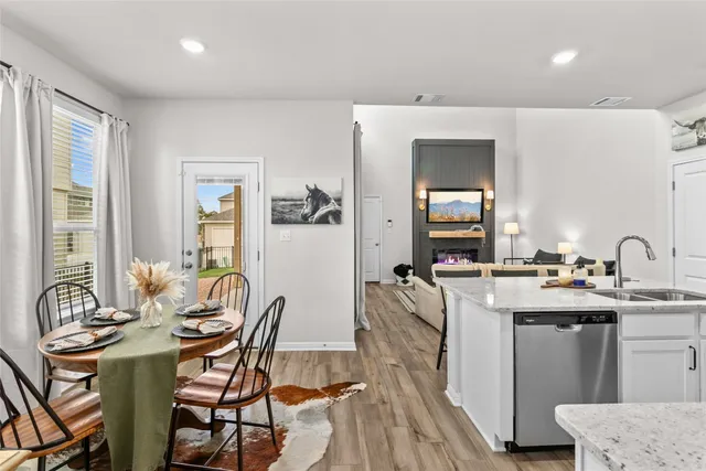 a view of a dining room with furniture and window
