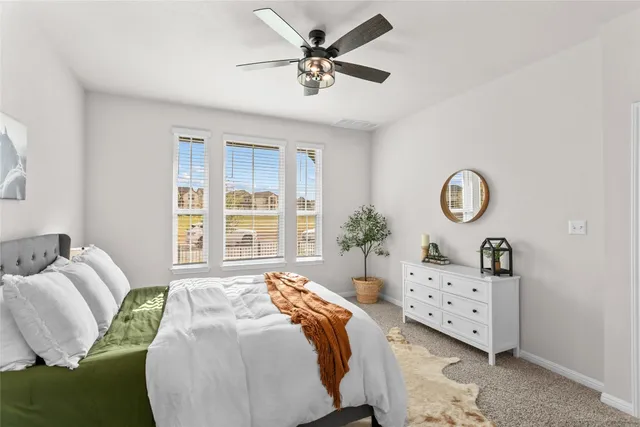 a bedroom with bed and a window