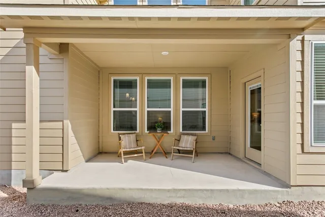 a view of a house with outdoor seating