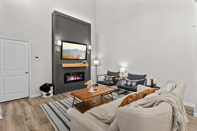 a bedroom with two beds and a fireplace