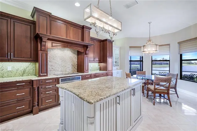 a kitchen with a counter space wooden cabinets and outdoor space