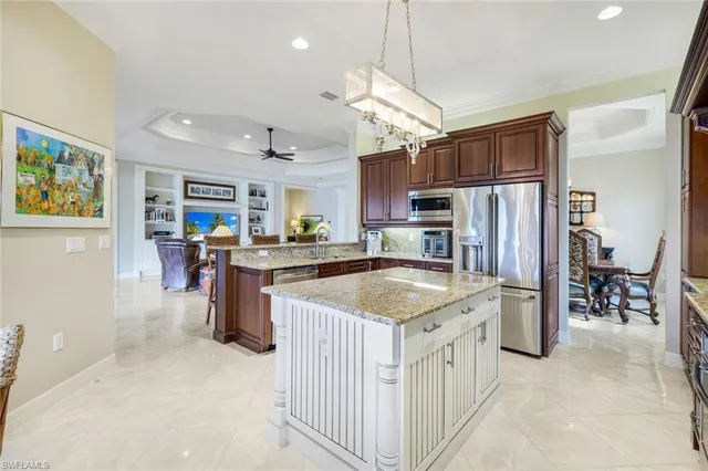 a kitchen with refrigerator and cabinets