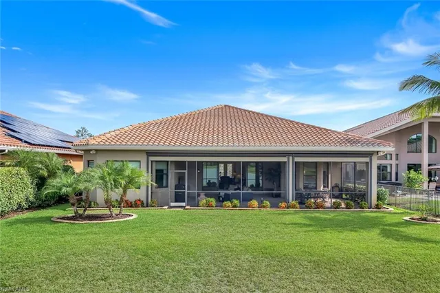 a view of a house with a yard patio and plants
