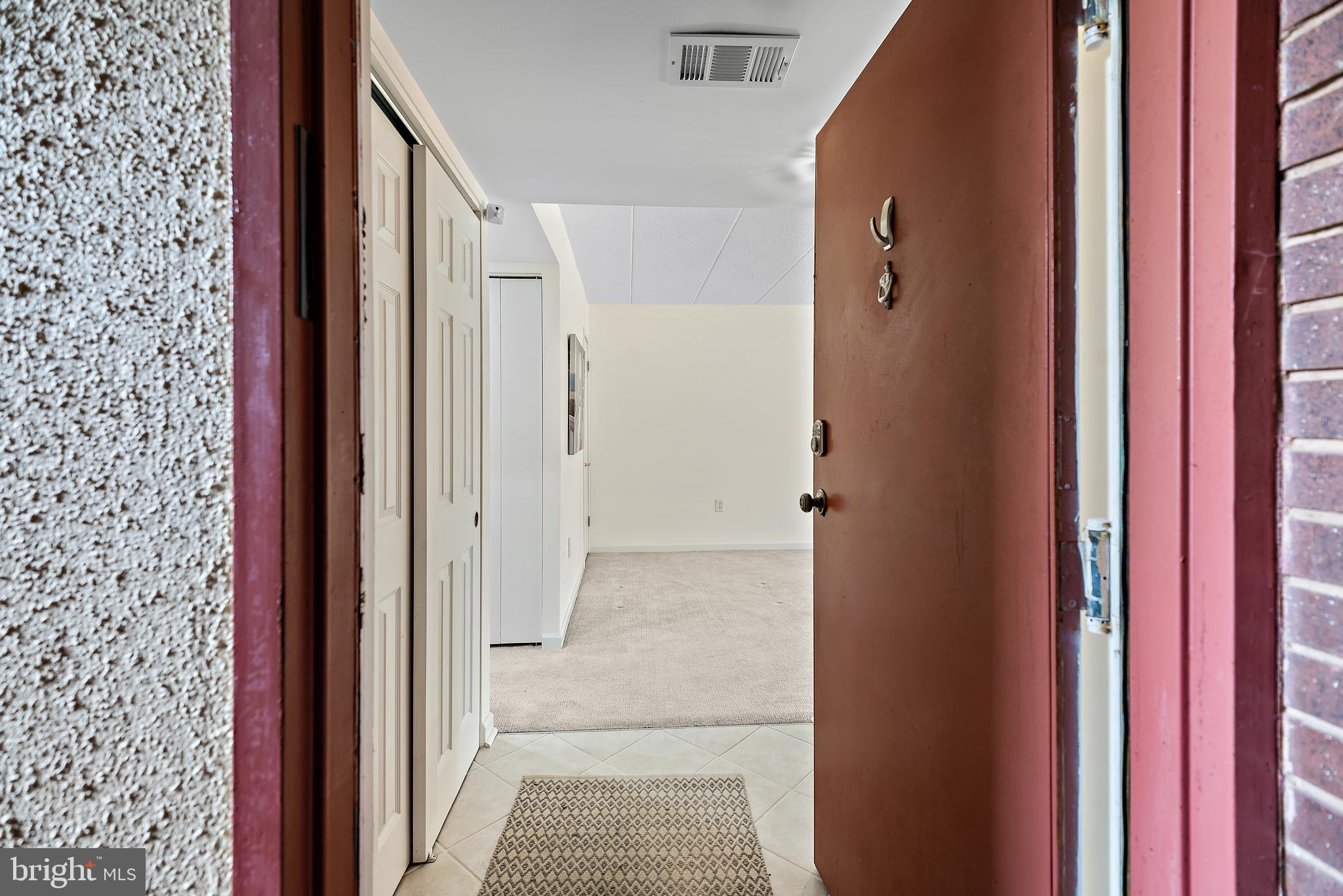5707 Harpers Farm Road, Unit A Columbia, MD 21044 - Photo 14 of 30 a view of a bathroom from a hallway