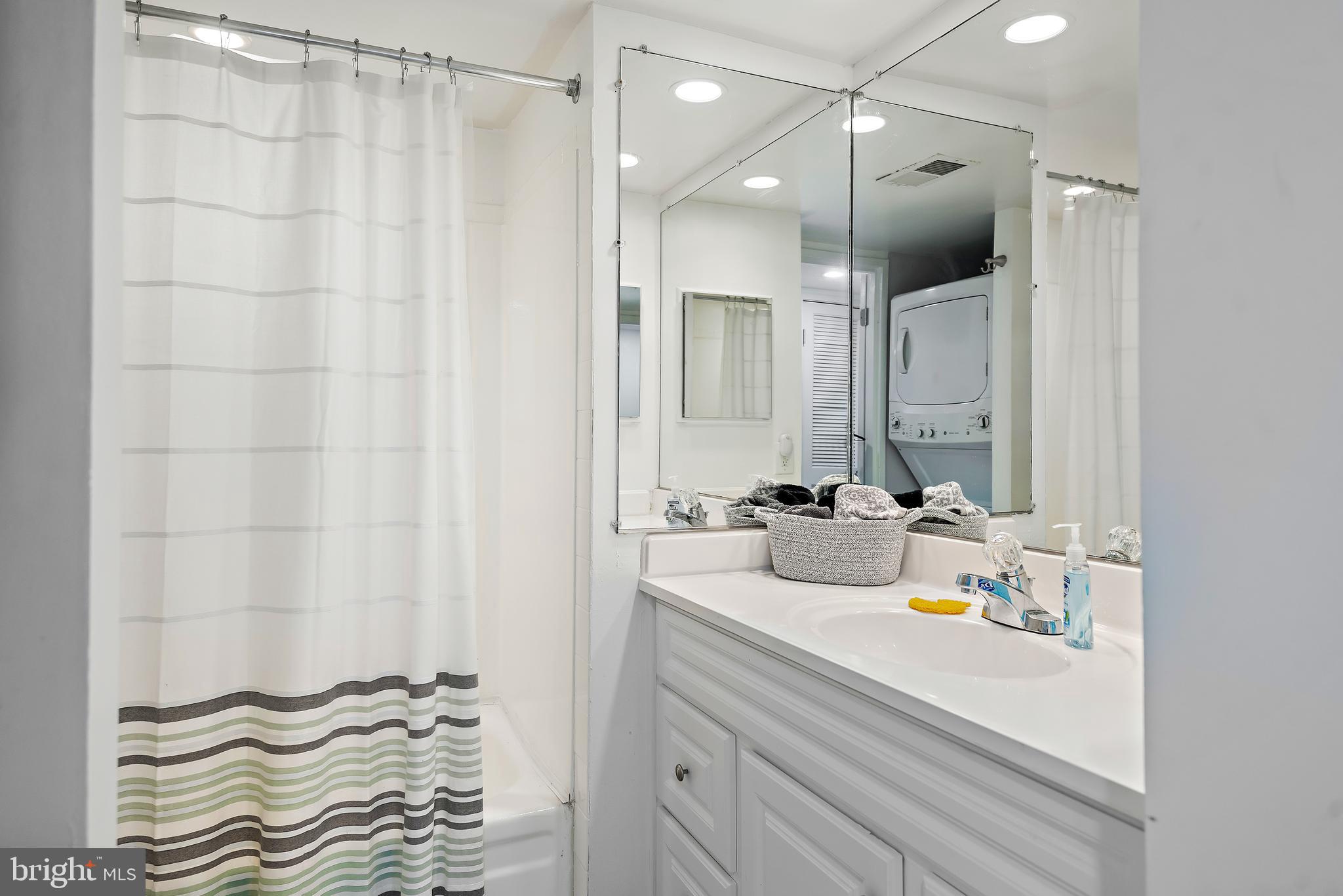 5707 Harpers Farm Road, Unit A Columbia, MD 21044 - Photo 19 of 30 a bathroom with a sink and a mirror
