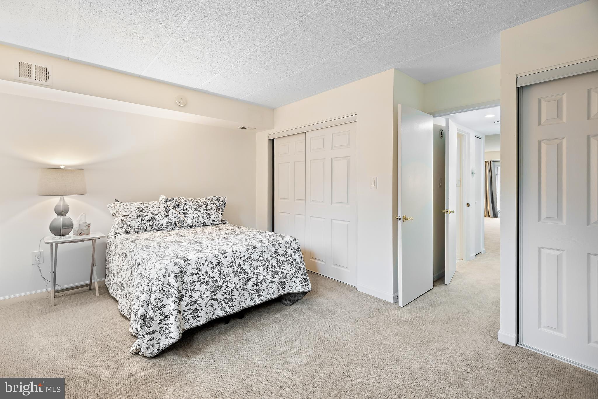 5707 Harpers Farm Road, Unit A Columbia, MD 21044 - Photo 21 of 30 a bedroom with a bed and a cabinets