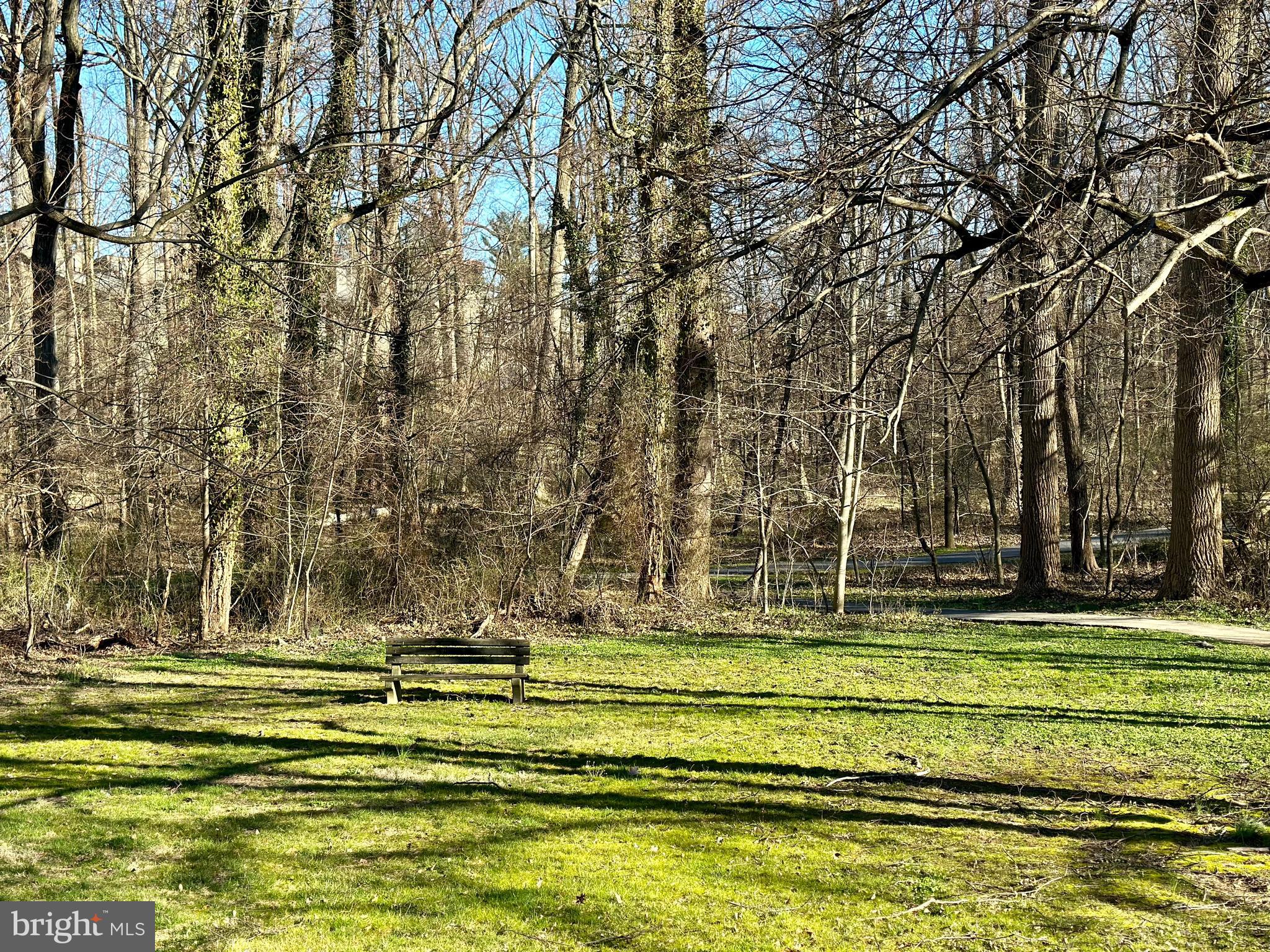 5707 Harpers Farm Road, Unit A Columbia, MD 21044 - Photo 4 of 30 a view of swimming pool with outdoor seating and trees