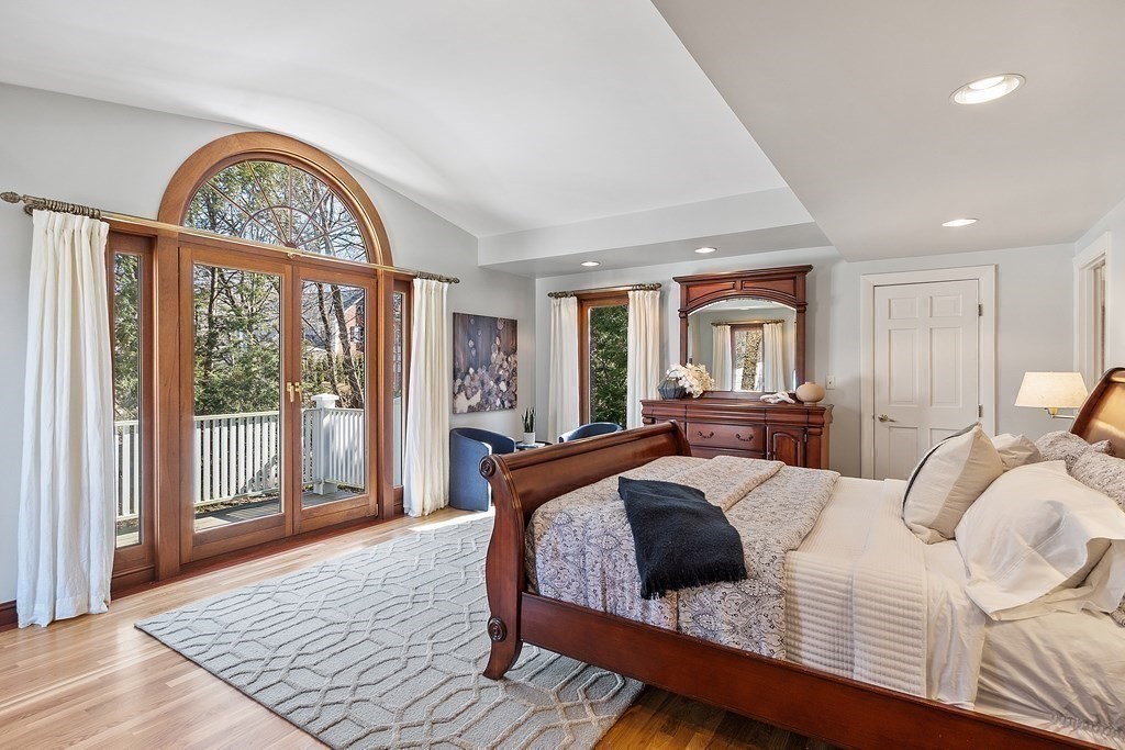 3 Goodwin Road Lexington, MA 02420 - Photo 20 of 38 a bedroom with a large bed and a large window