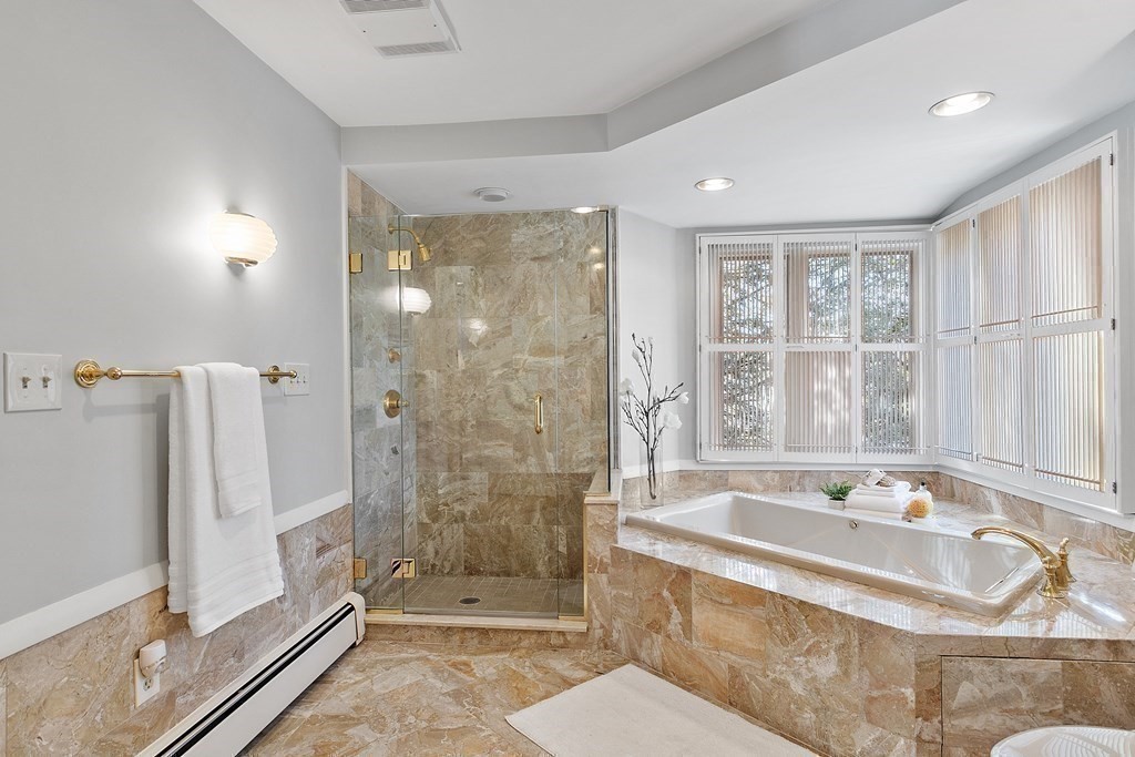3 Goodwin Road Lexington, MA 02420 - Photo 23 of 38 a bathroom with a bathtub and a shower