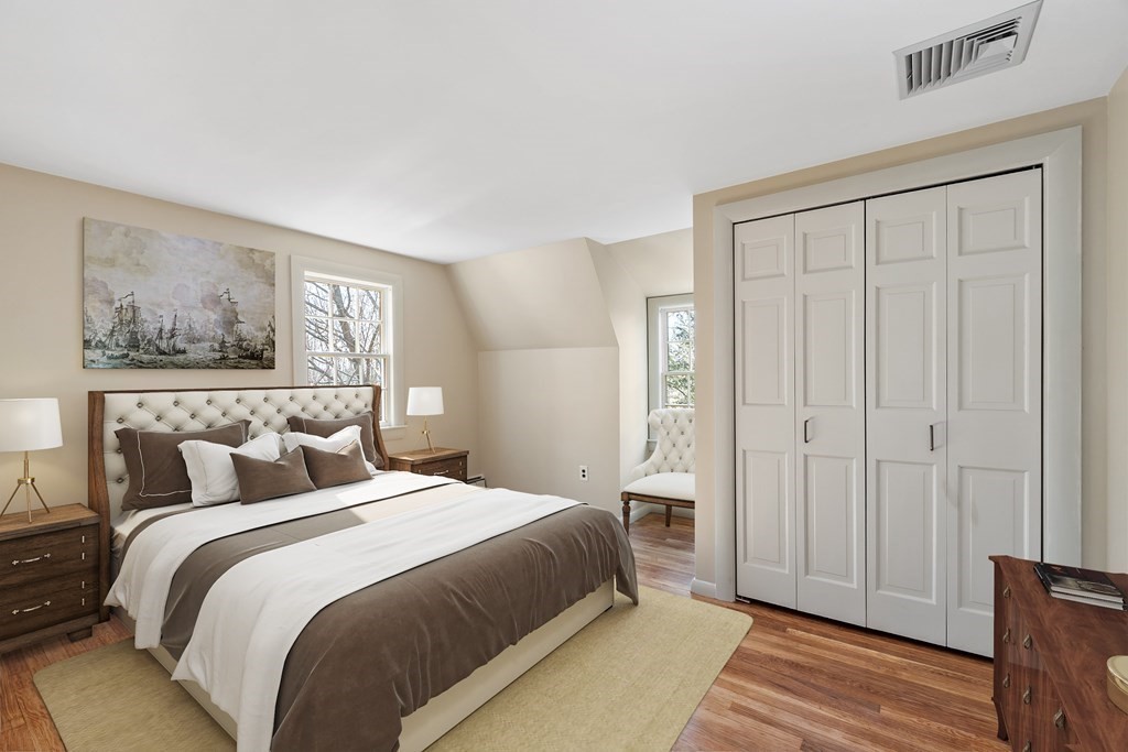 3 Goodwin Road Lexington, MA 02420 - Photo 26 of 38 a bedroom with a bed and a painting on the wall