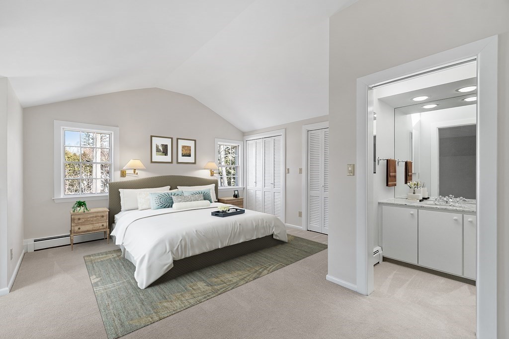 3 Goodwin Road Lexington, MA 02420 - Photo 31 of 38 a bedroom with a bed and a large mirror