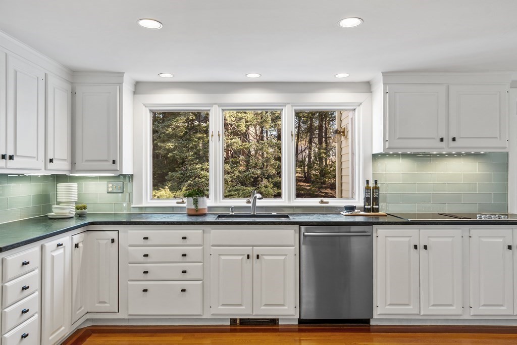 3 Goodwin Road Lexington, MA 02420 - Photo 8 of 38 a kitchen with granite countertop a sink and cabinets