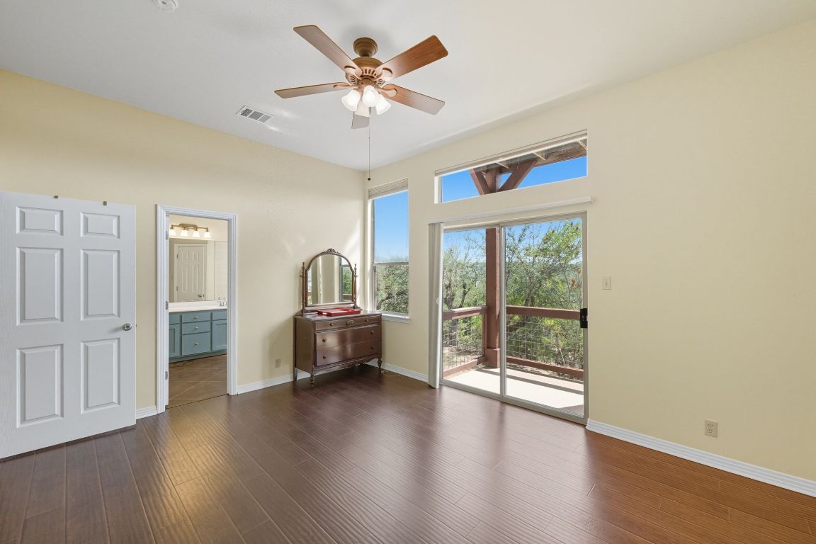 1101 Oak Hurst Road, Unit 100 Austin, TX 78734 - Photo 17 of 35 a view of livingroom with furniture wooden floor and window