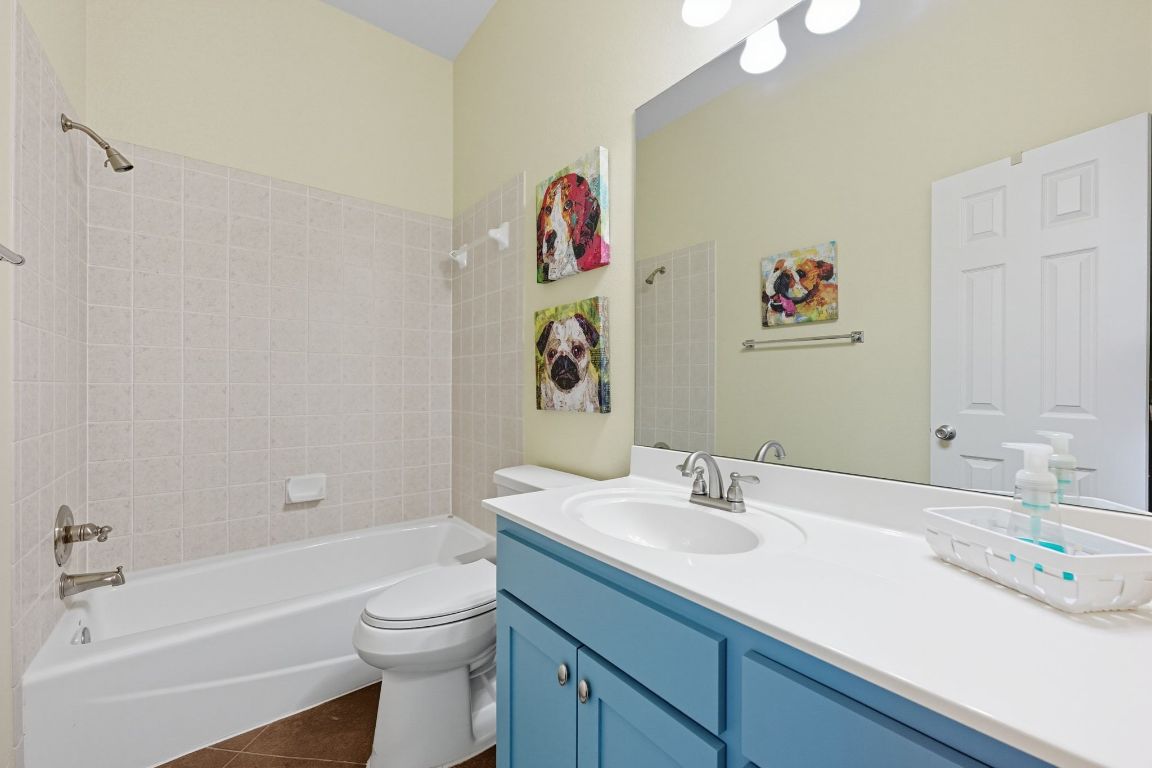 1101 Oak Hurst Road, Unit 100 Austin, TX 78734 - Photo 21 of 35 a bathroom with a sink a toilet and a bathtub