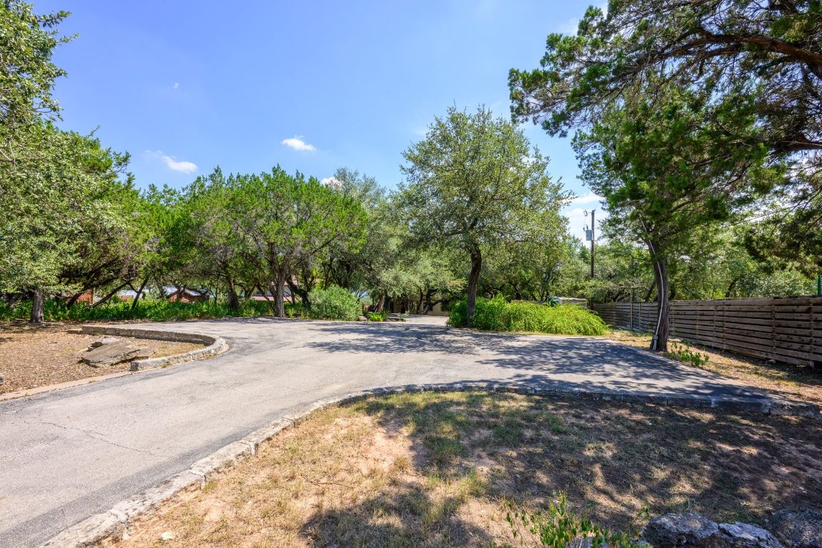 1101 Oak Hurst Road, Unit 100 Austin, TX 78734 - Photo 28 of 35 a view of a street with a yard