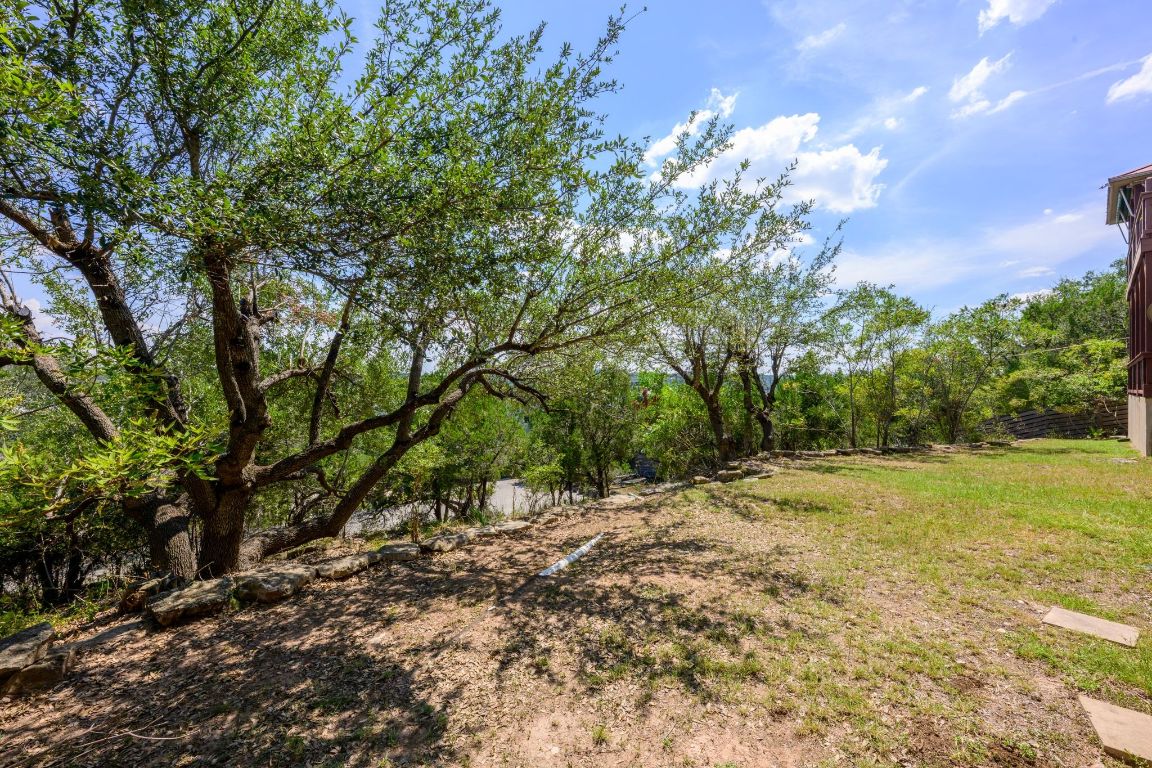 1101 Oak Hurst Road, Unit 100 Austin, TX 78734 - Photo 31 of 35 a view of outdoor space with trees all around