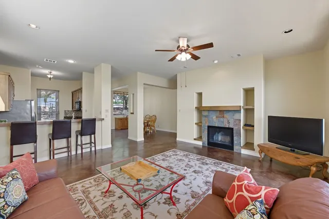 a living room with furniture or flat screen tv and a fireplace