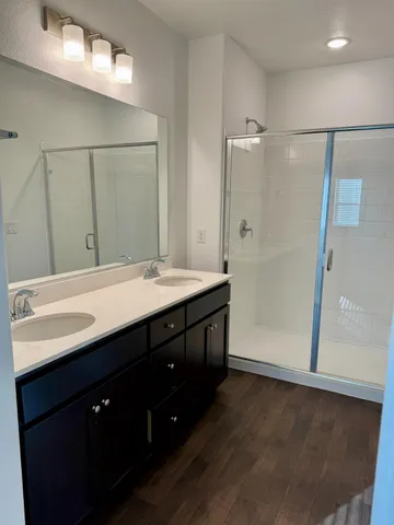 a white toilet sitting next to a shower