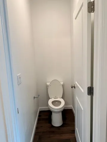 a bathroom with a glass shower door and a sink