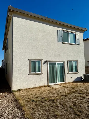 a house view with a backyard space