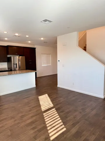 a view of a kitchen with utility room and wooden floor